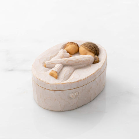 Willow Tree size comparison next to a hand, shows compact dimensions and gift suitability