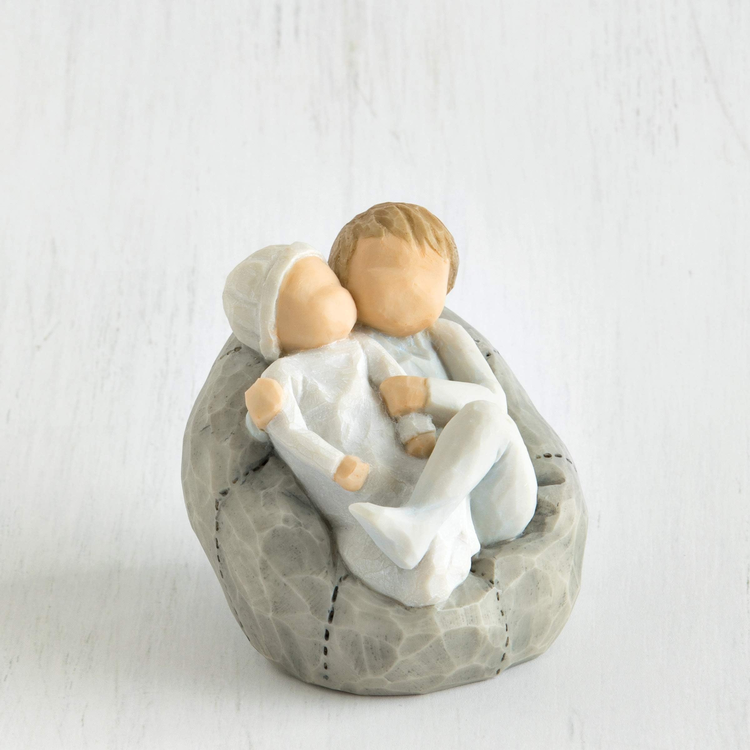 Willow Tree toddler holding infant showing tender sibling connection