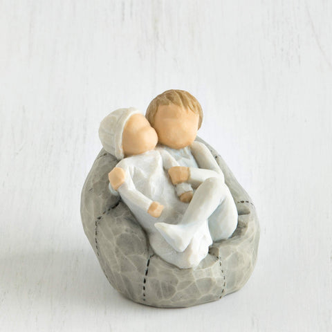 Willow Tree toddler holding infant showing tender sibling connection