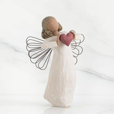 Willow Tree close-up on red heart in hands highlights handcrafted detail