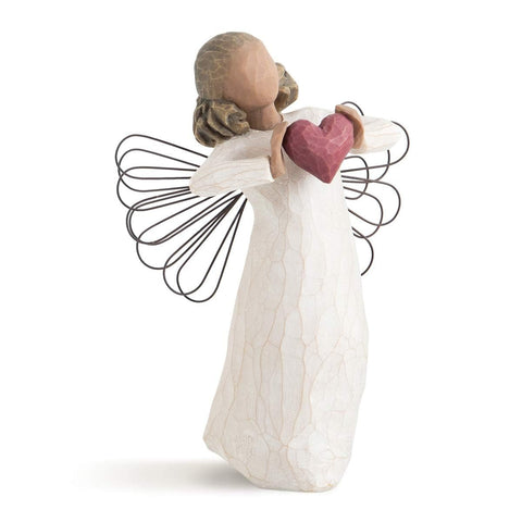 Willow Tree front view of angel holding red heart shows loving gesture