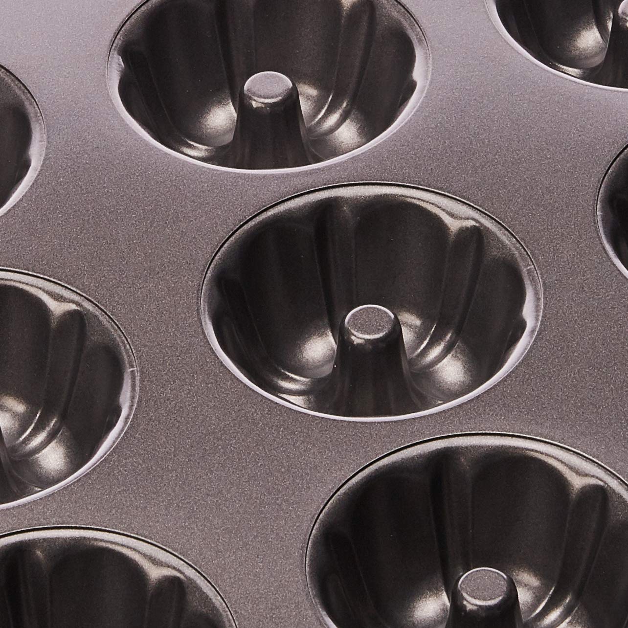 Wilton pan with baked mini cakes cooling, shows consistent portions benefit