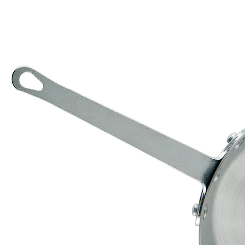 Winco saucepan in use stirring sauce to demonstrate control and easy whisking
