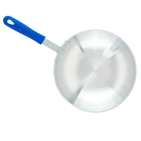 Winco lifestyle shot serving stir-fry from pan showing practical presentation