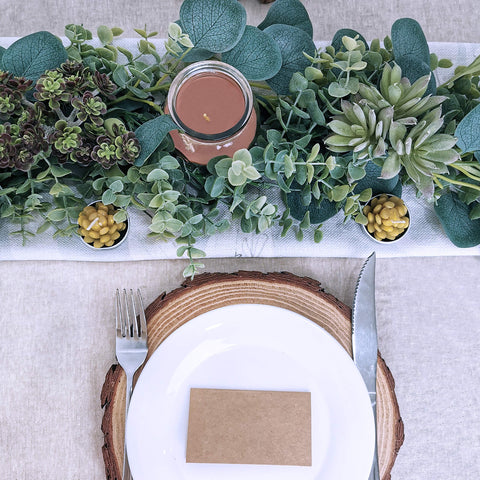 Winlyn garland fashioned into a doorway wreath adding welcome and lasting greenery