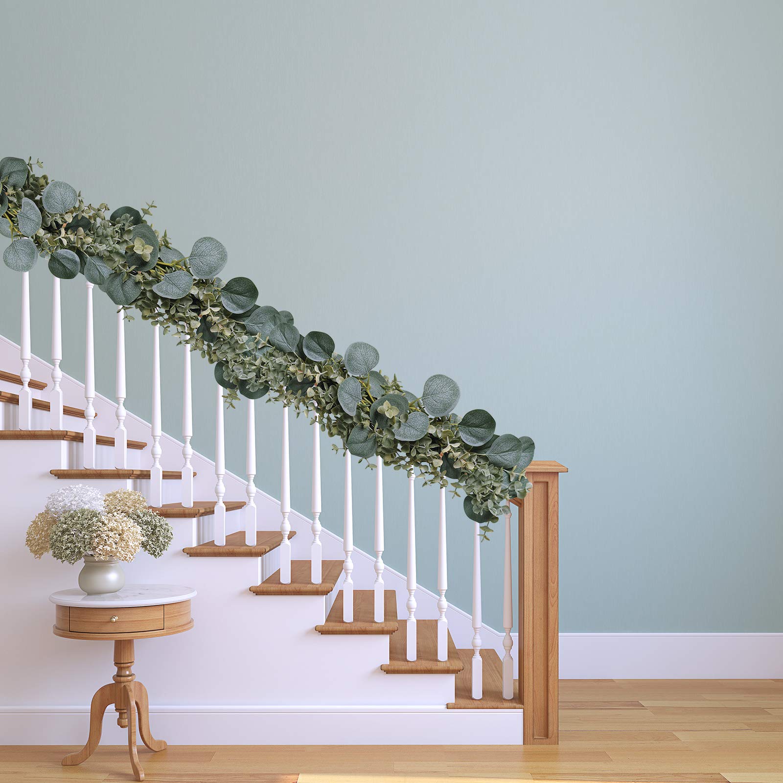 Winlyn garland woven through a chandelier softening lights and adding dimension