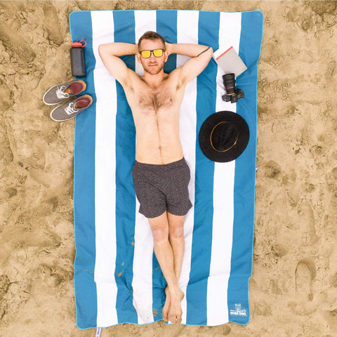 Wise Owl Outfitters towel in use on beach showing comfortable lounging and quick drying