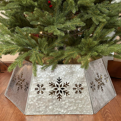 WKHOMEDECO front view of galvanized tree collar showing full snowflake design and tidy base concealment