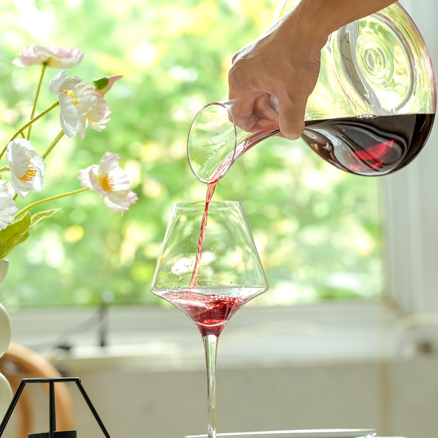 Wlasss decanter on dining table with glasses showing refined presentation and gifting benefit