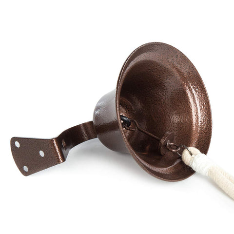 WMM bell next to hand for scale showing compact size ideal for entryways