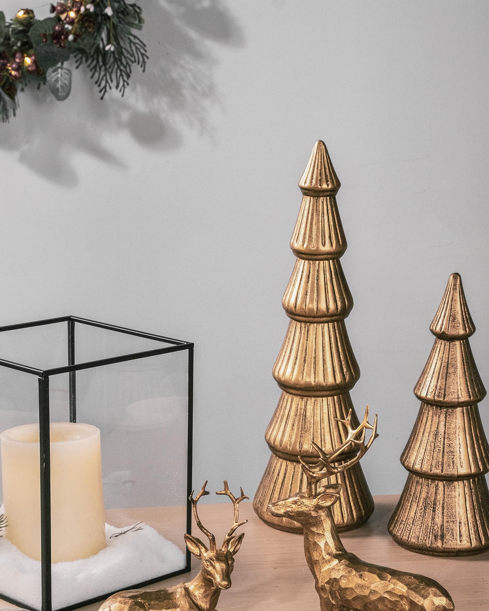WONDROUS' DECO trees styled on a mantel adding festive warmth to living room decor