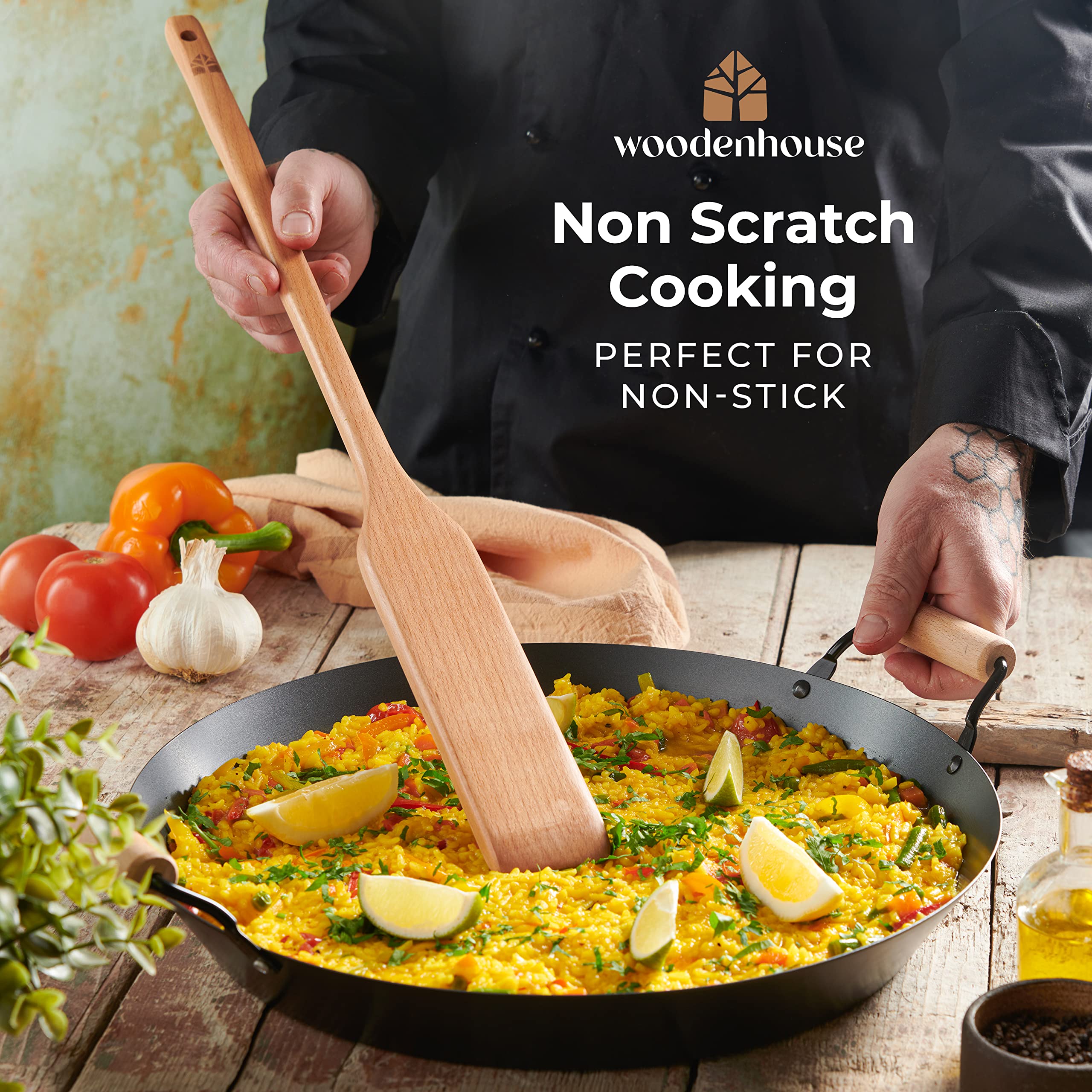 Woodenhouse blade folding fried rice in a wok to show broad surface and strong leverage