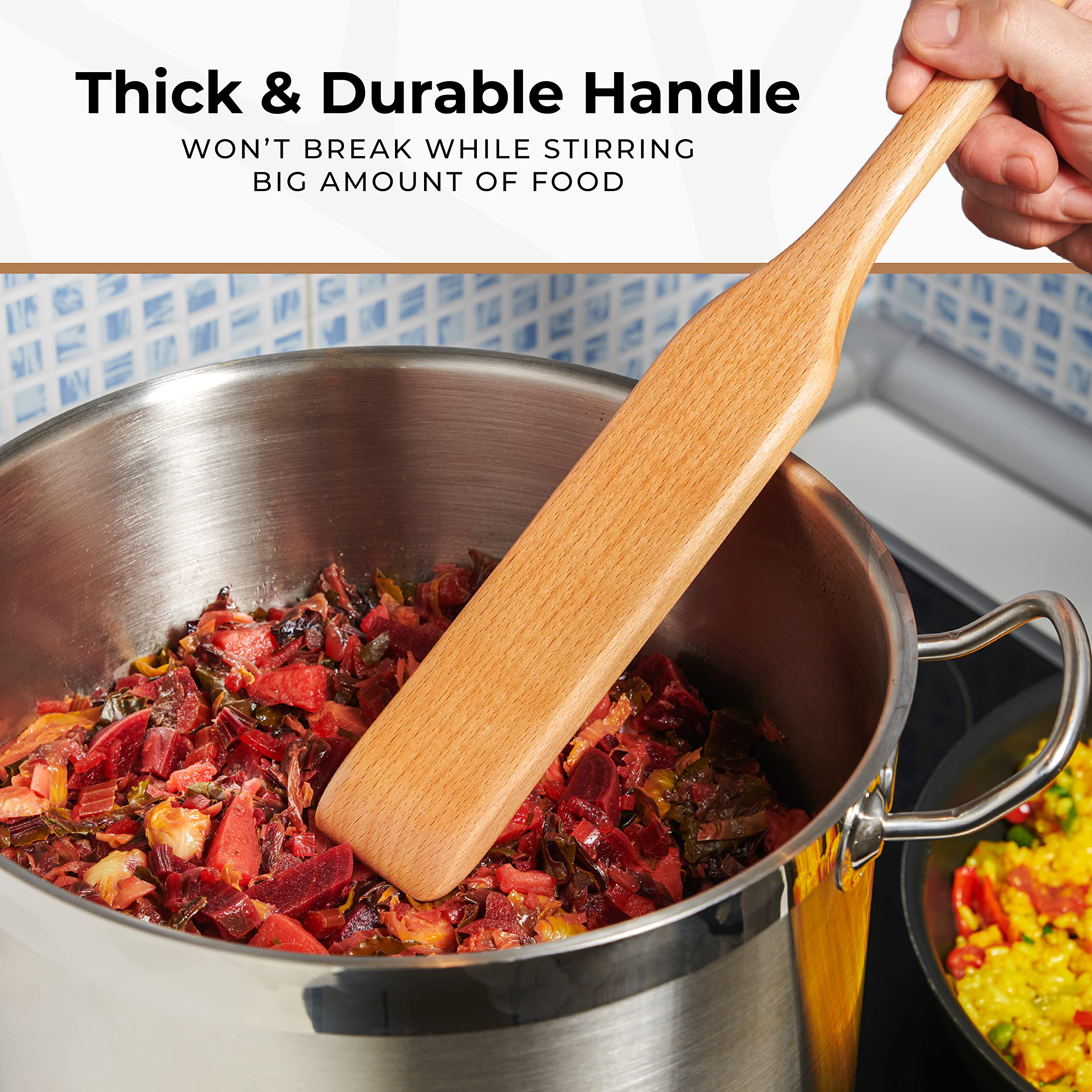 Woodenhouse paddle stirring a crawfish boil in a large stockpot for efficient mixing