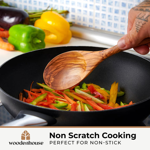 Woodenhouse tongs in use tossing salad without scratching bowl surface