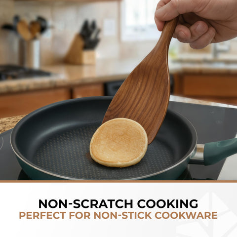 Woodenhouse spatula in nonstick pan protecting coating while flipping food