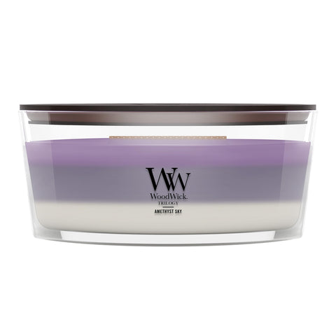 WoodWick front view of Amethyst & Amber ellipse candle showing elegant vessel and crackling wick benefit
