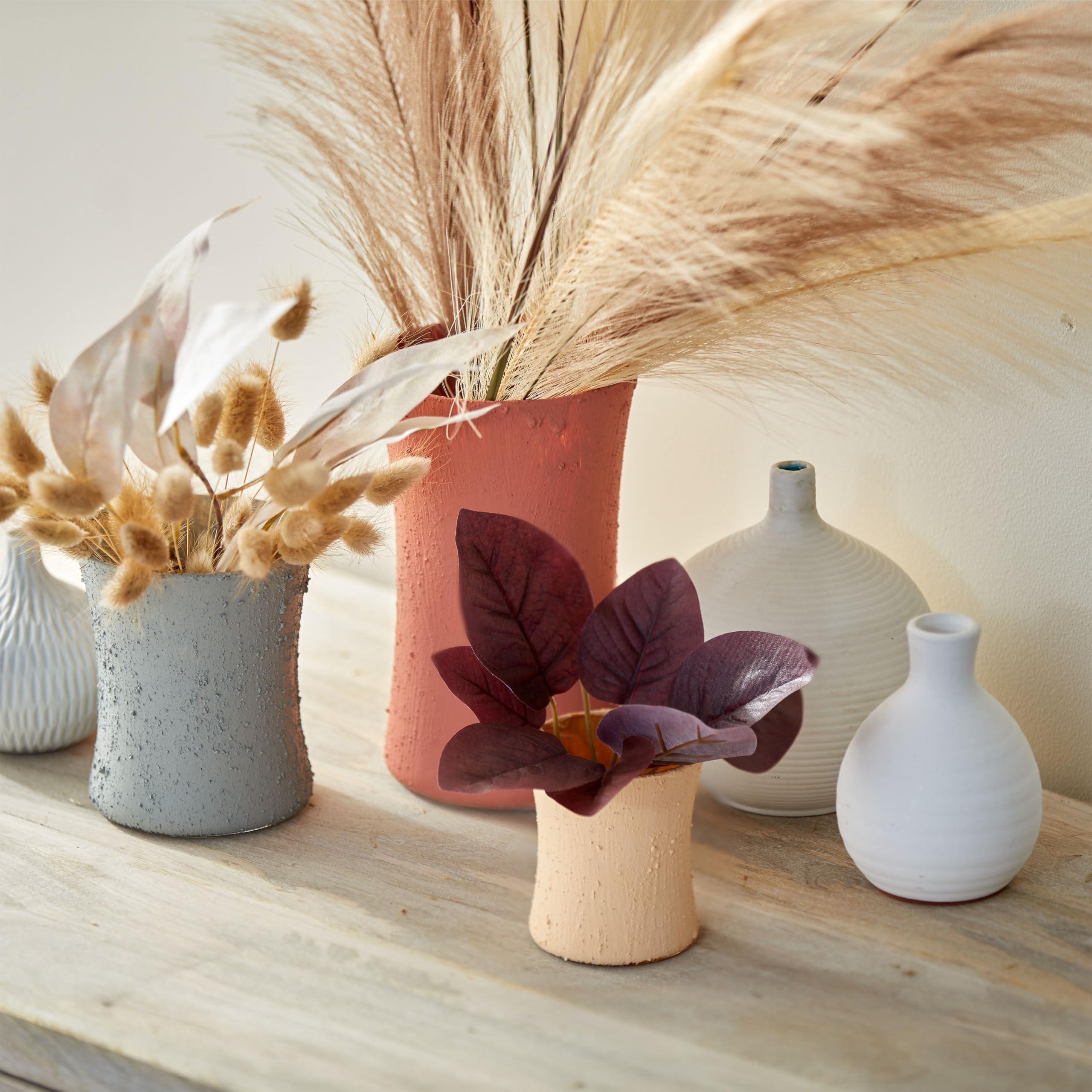 WoodWick on a beachside table staging a coastal vibe and decorative appeal