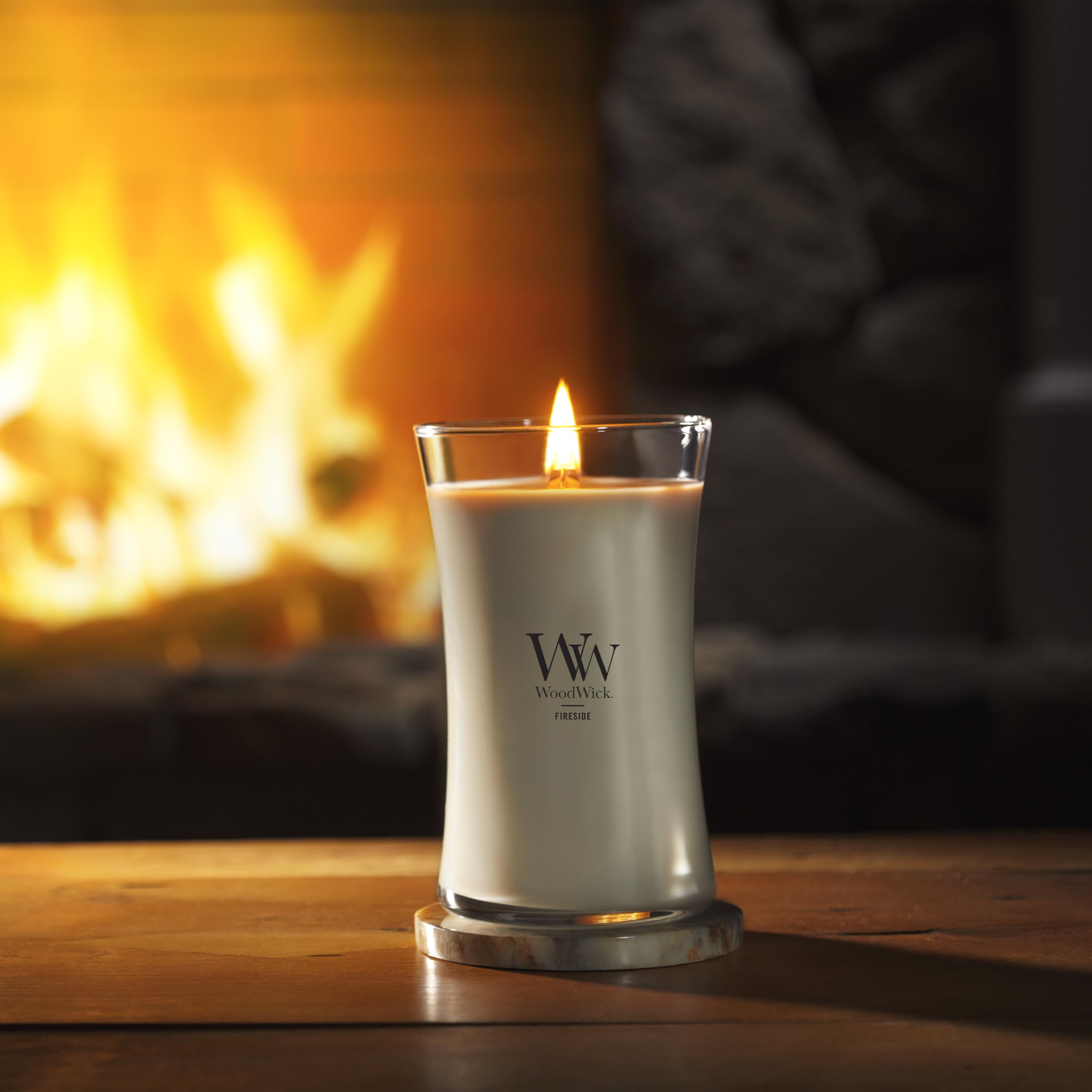 WoodWick gift-wrapped candle on table showing present-ready benefit: perfect gifting