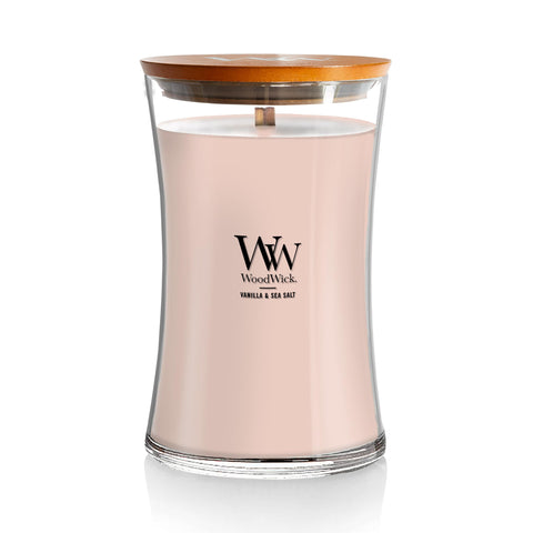 WoodWick hourglass front view showing elegant jar and warm glow benefit
