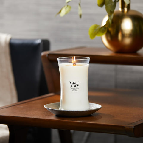 WoodWick candle in living room lifestyle setting showing atmosphere and design benefit