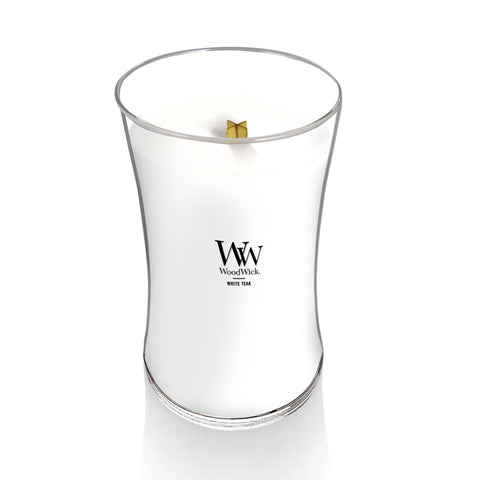 WoodWick Pluswick flame closeup showing crackling wood wick and warm glow benefit
