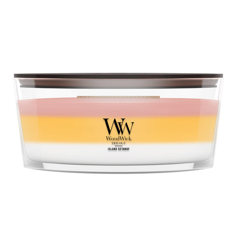 WoodWick(ウッドウィック) front view of Island Getaway trilogy candle showing packaging and benefits