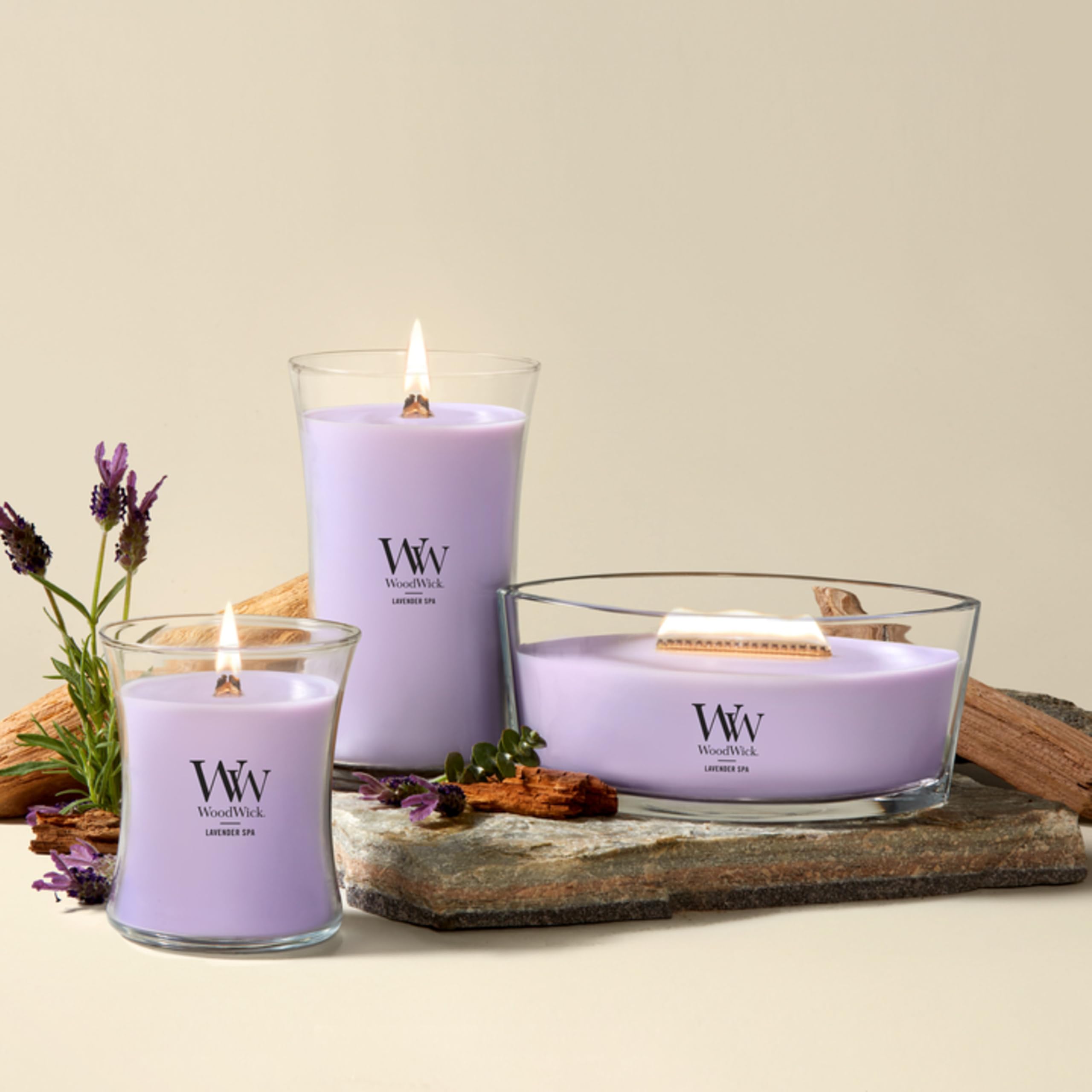 WoodWick(ウッドウィック) candle next to a coffee mug for scale showing large 21.5 oz size