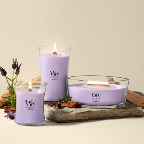 WoodWick(ウッドウィック) candle next to a coffee mug for scale showing large 21.5 oz size
