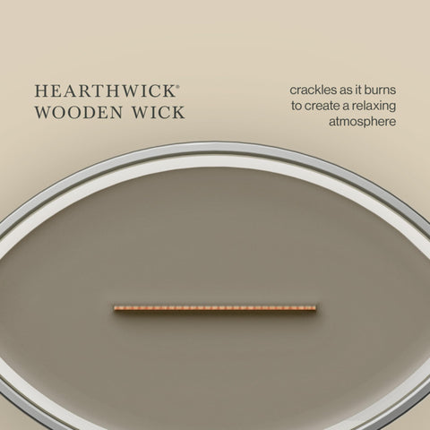 WoodWick(ウッドウィック) candle held in hand showing 16 oz scale and long-lasting burn benefit