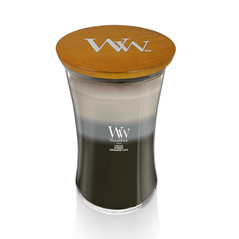 WoodWick label and wax pour close-up showing layered scents and premium finish