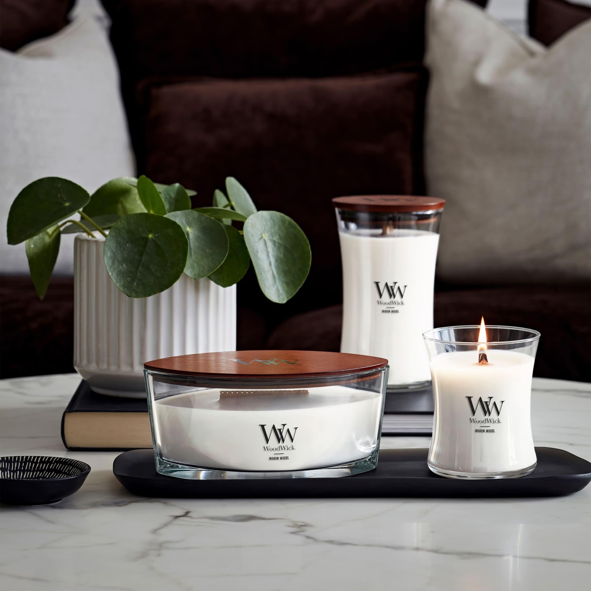 WoodWick Warm Wool burning with melt pool demonstrating steady aroma benefit