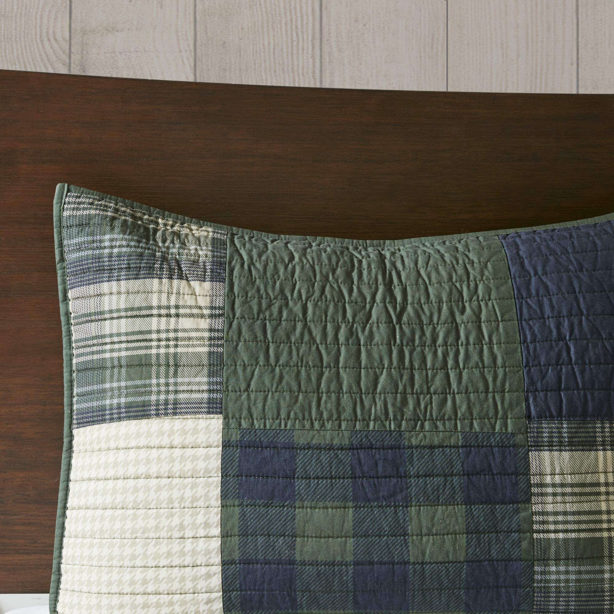 Woolrich Mill Creek quilt next to ruler for scale, demonstrates oversized coverage benefit