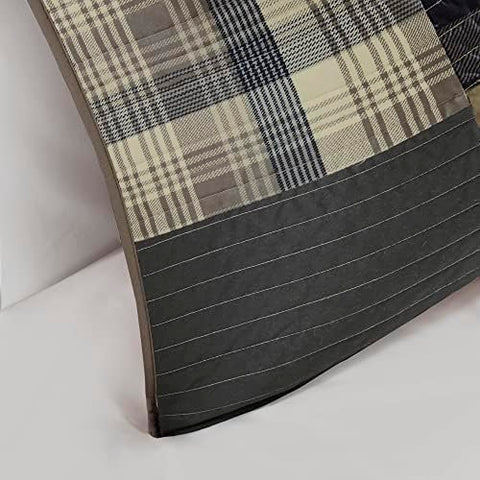 Woolrich on queen bed demonstrating oversized coverage and drape