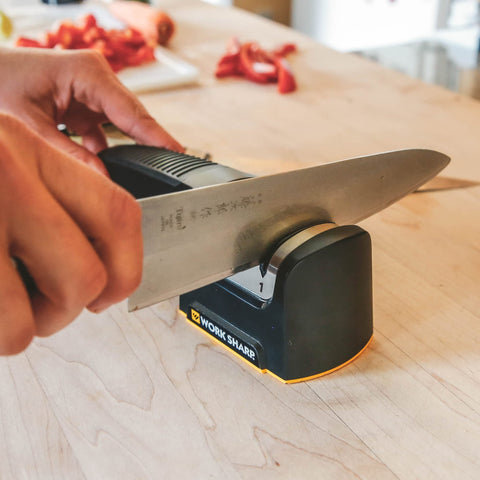 WORK SHARP beside a ruler for size comparison showing compact dimensions and scale
