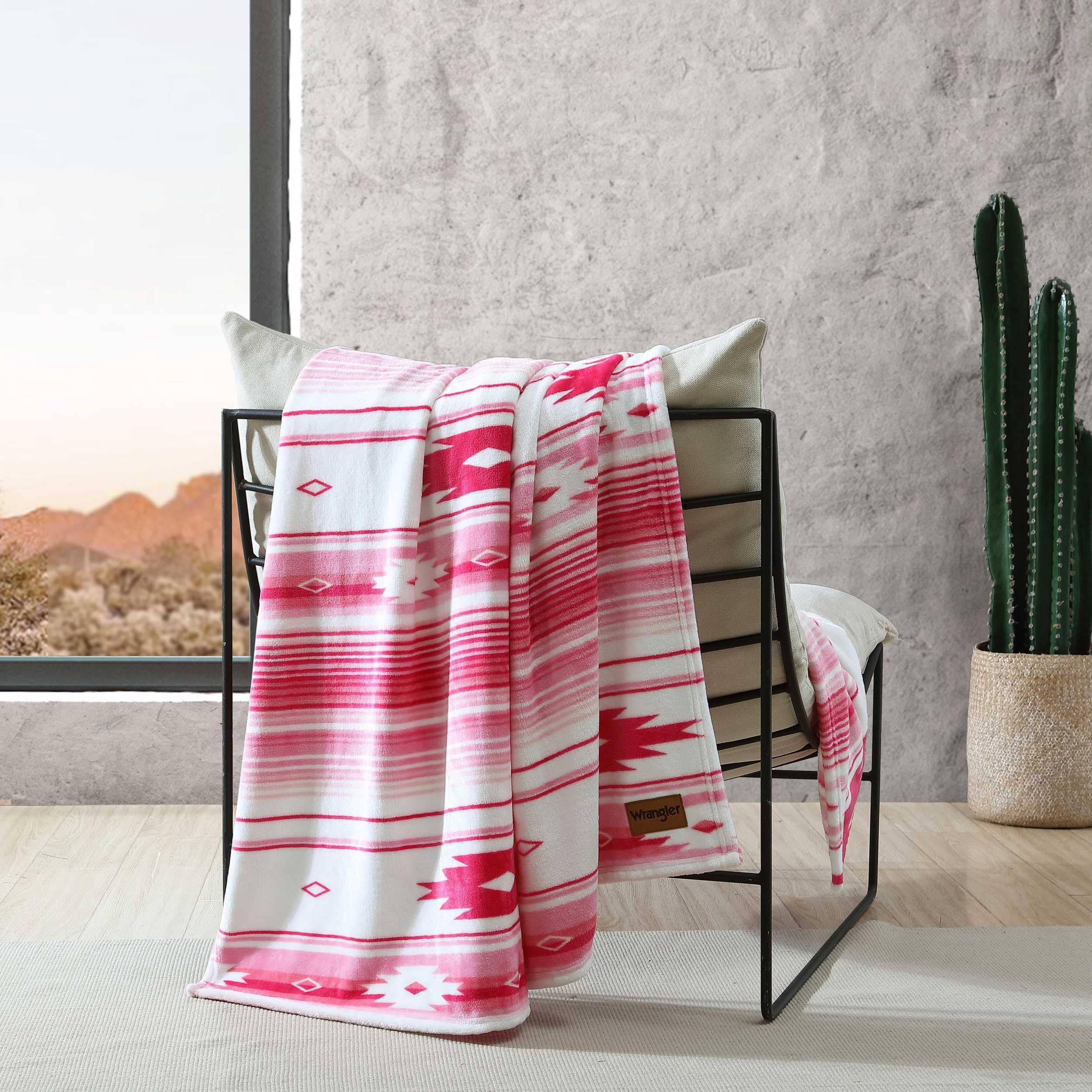 Wrangler throw on bed displays layered decor and versatile styling benefit