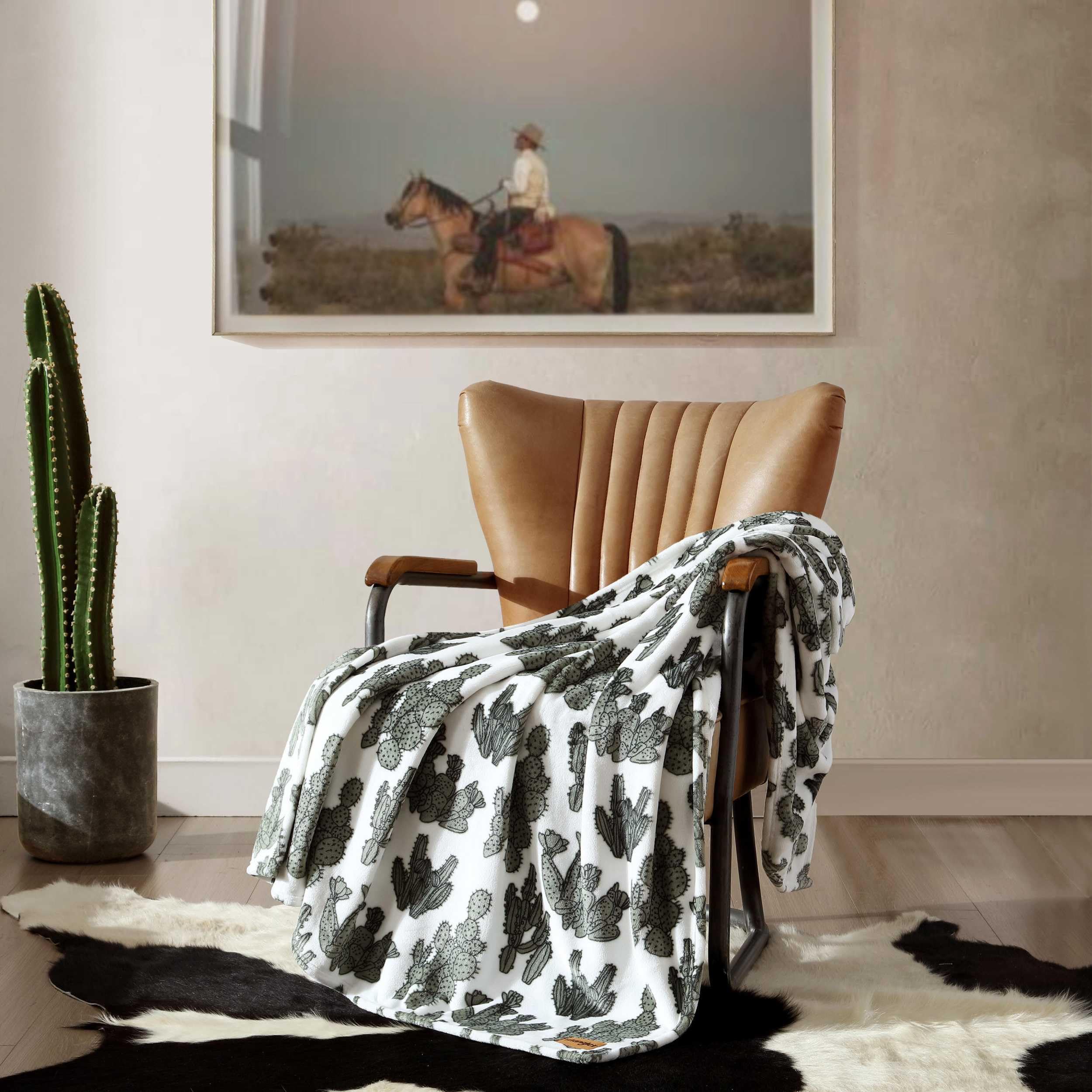 Wrangler throw on twin bed showing scale and decorative layering benefit