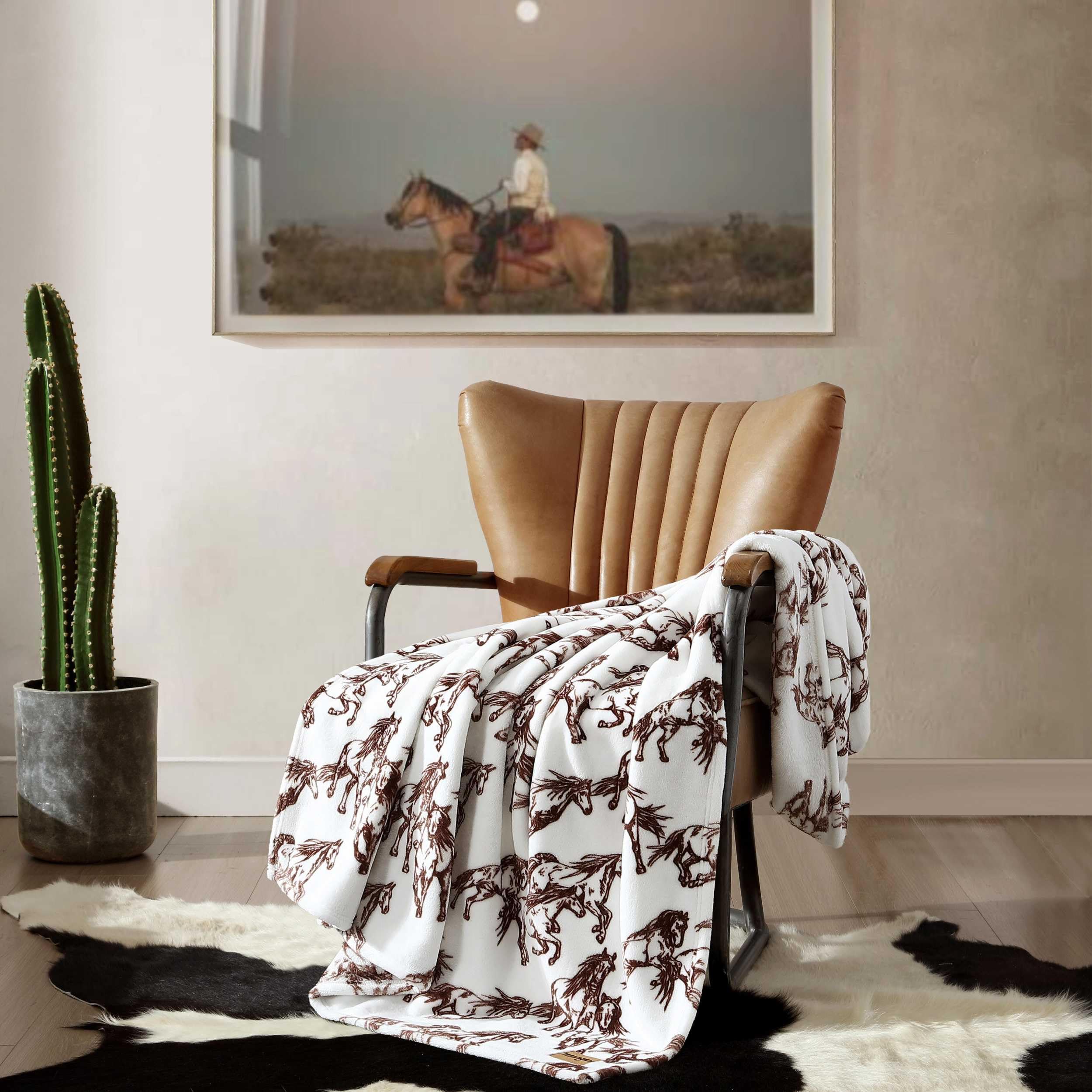 Wrangler throw spread at foot of bed adding layered bedding style