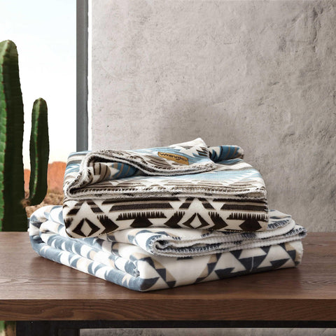 Wrangler blanket draped outdoors at evening offering portable warmth