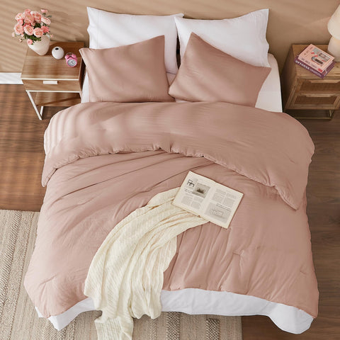 WRENSONGE comforter laid on queen bed showing generous coverage and cozy look