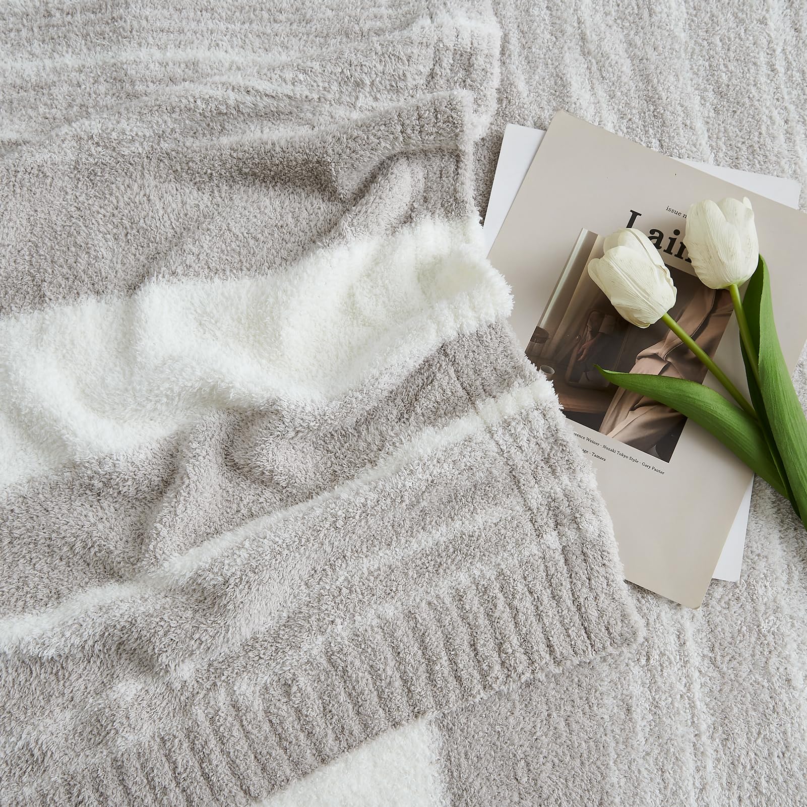 WRENSONGE draped on a couch adding style and cozy comfort to living room