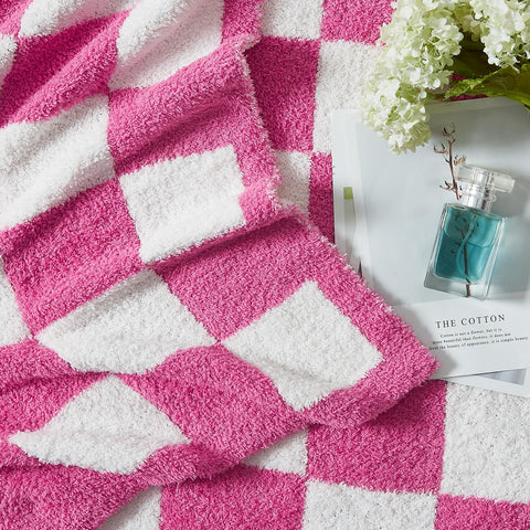 WRENSONGE folded throw draped on sofa adding cozy decor and color