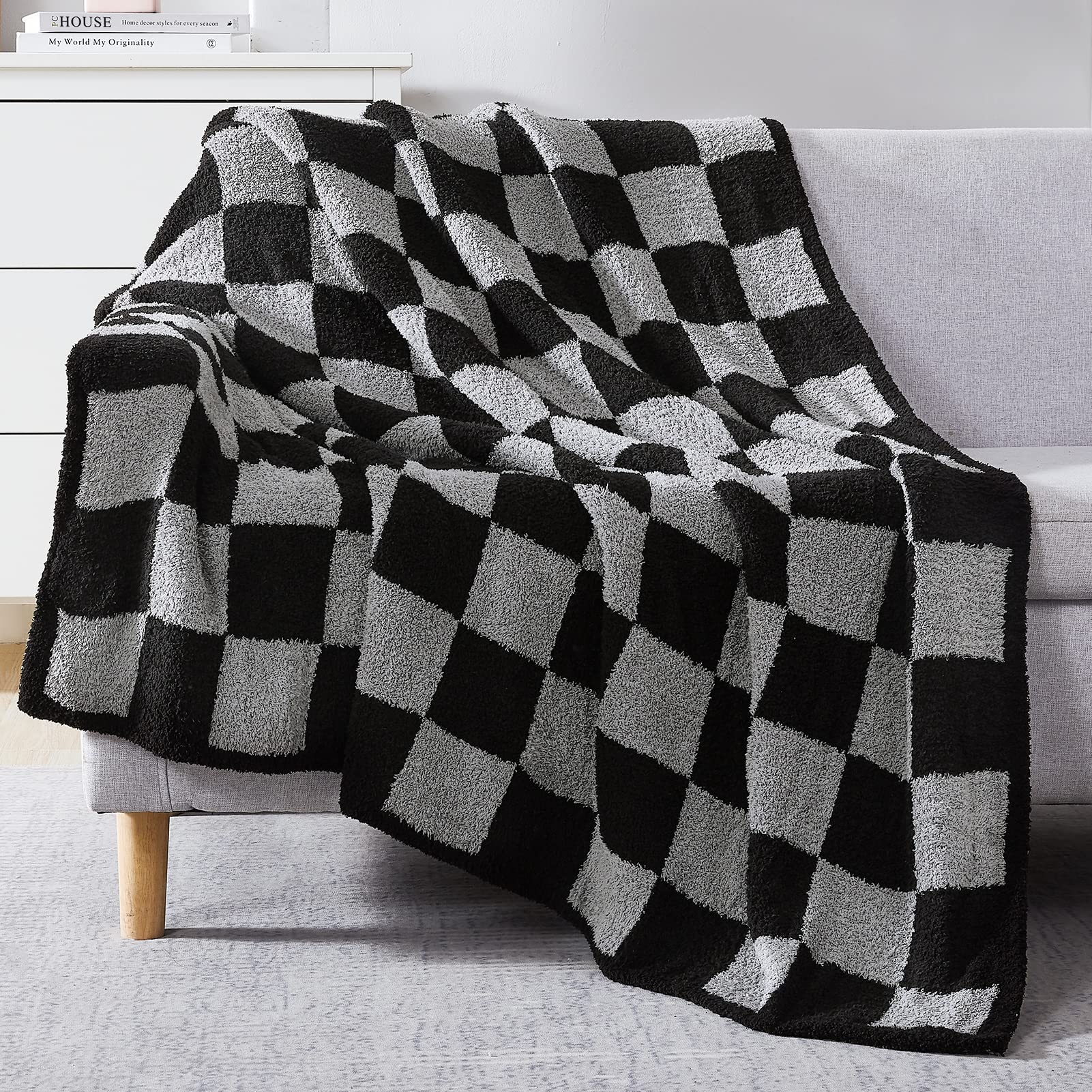 WRENSONGE folded throw on couch showing check pattern and cozy appeal