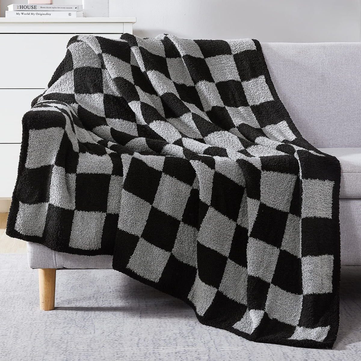 WRENSONGE folded throw on couch showing check pattern and cozy appeal