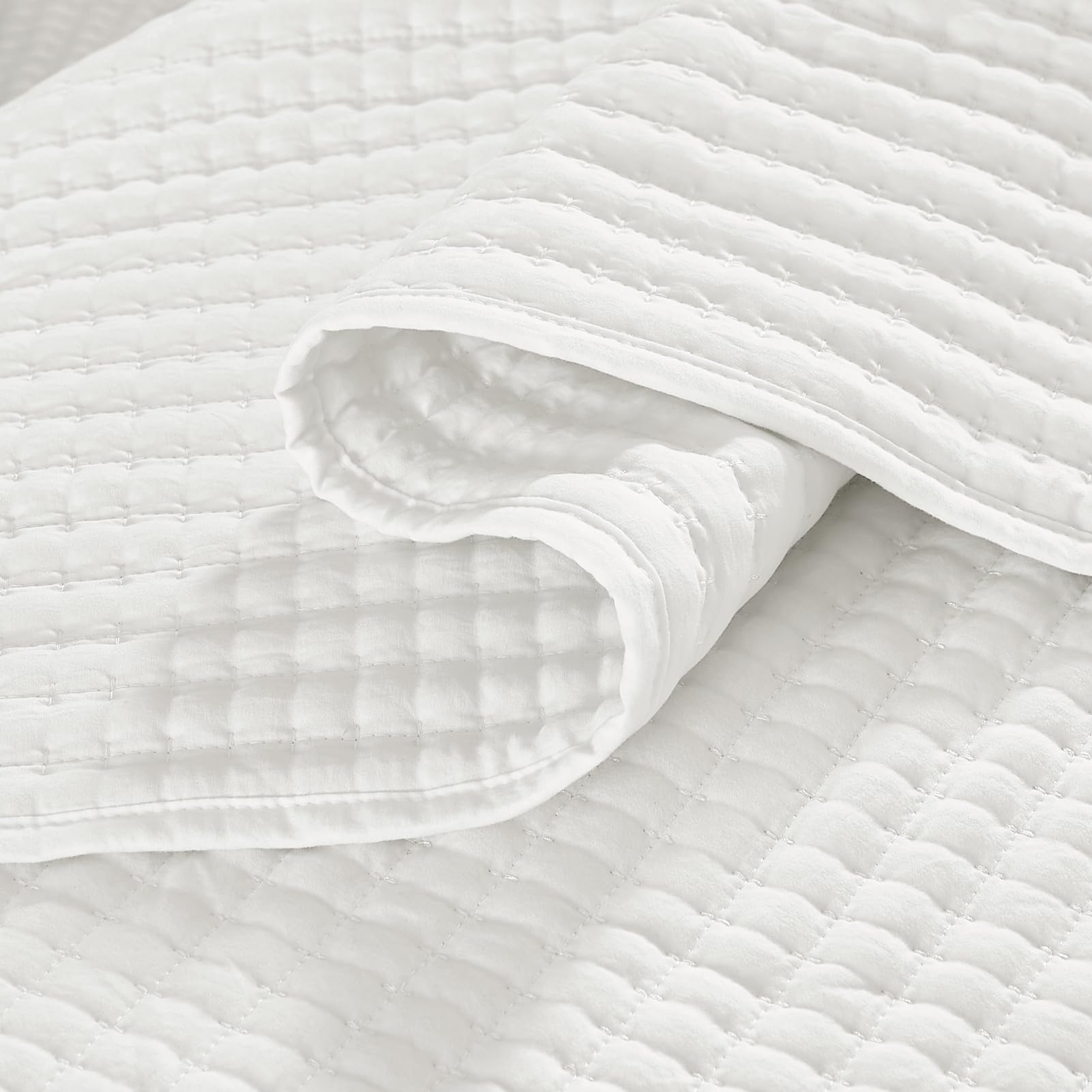 WRENSONGE quilt on bed styled in bedroom showing refined modern accent