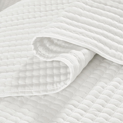 WRENSONGE quilt on bed styled in bedroom showing refined modern accent