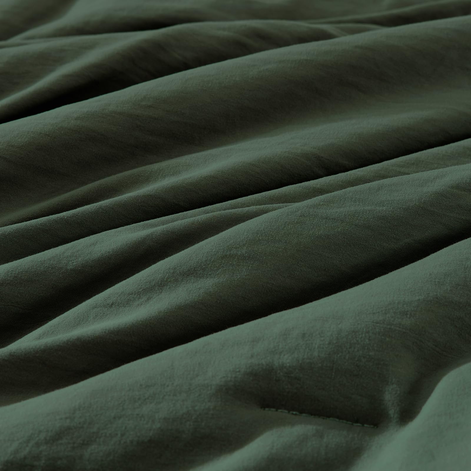 WRENSONGE comforter next to queen mattress showing true-size coverage