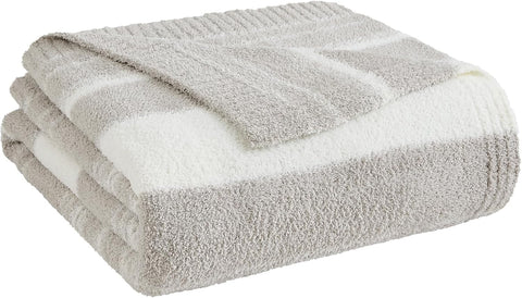 WRENSONGE next to common items to show blanket size and practical scale
