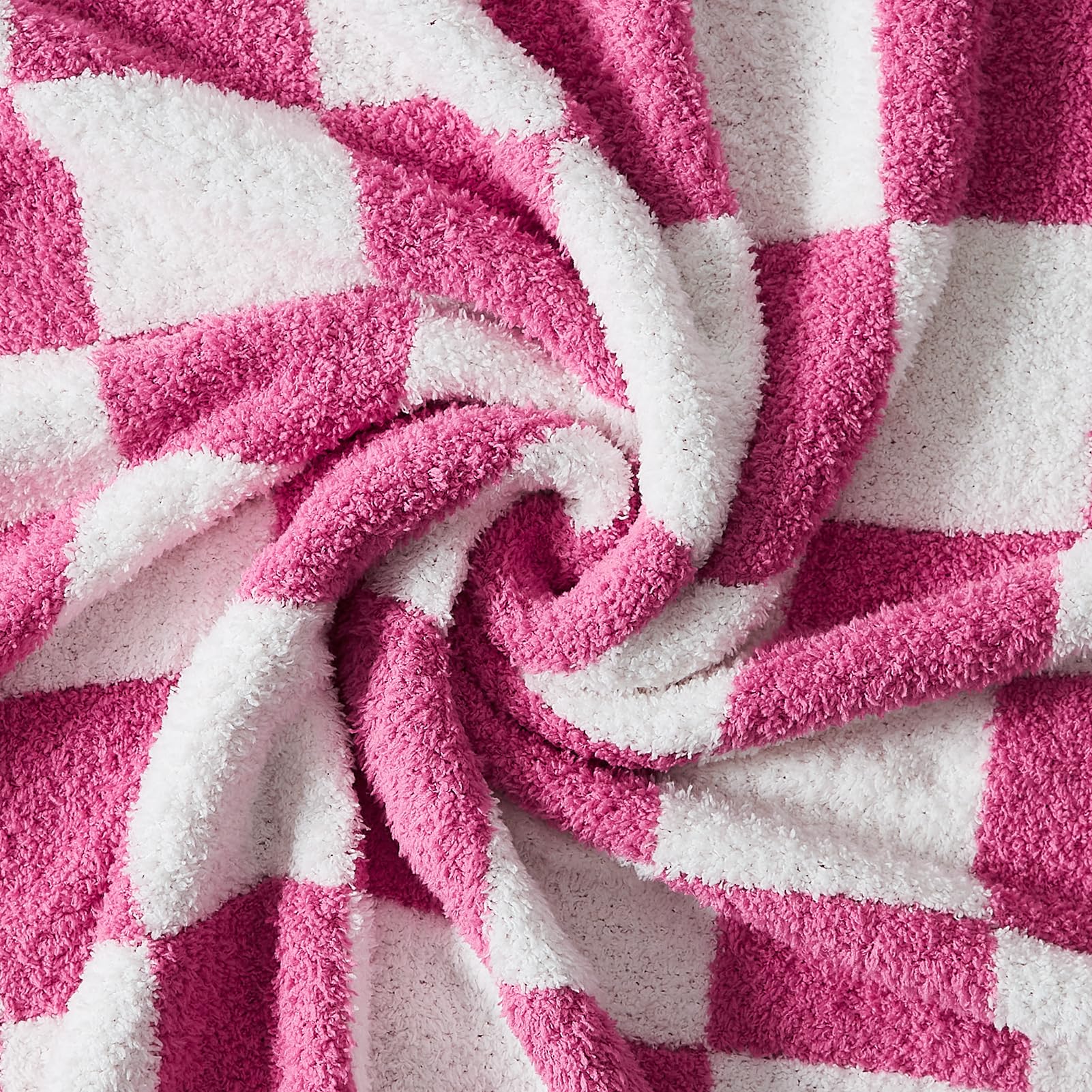 WRENSONGE throw laid on bed highlighting size and decorative appeal