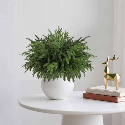 Wsorik mantel styled with pine branches offering low-maintenance decor