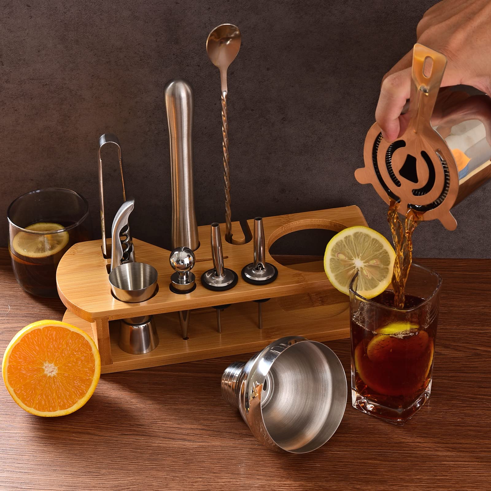 Wukuna jigger and liquor pourers next to bottle, accurate measuring for consistent drinks